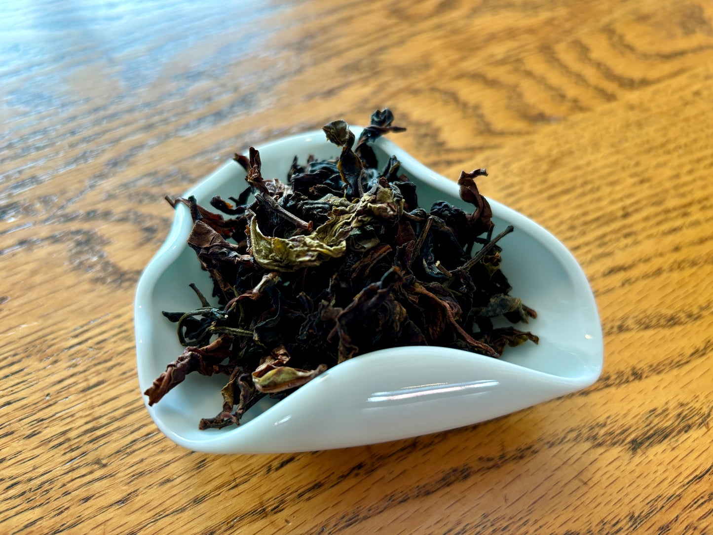 A ceramic display of dried loose black tea