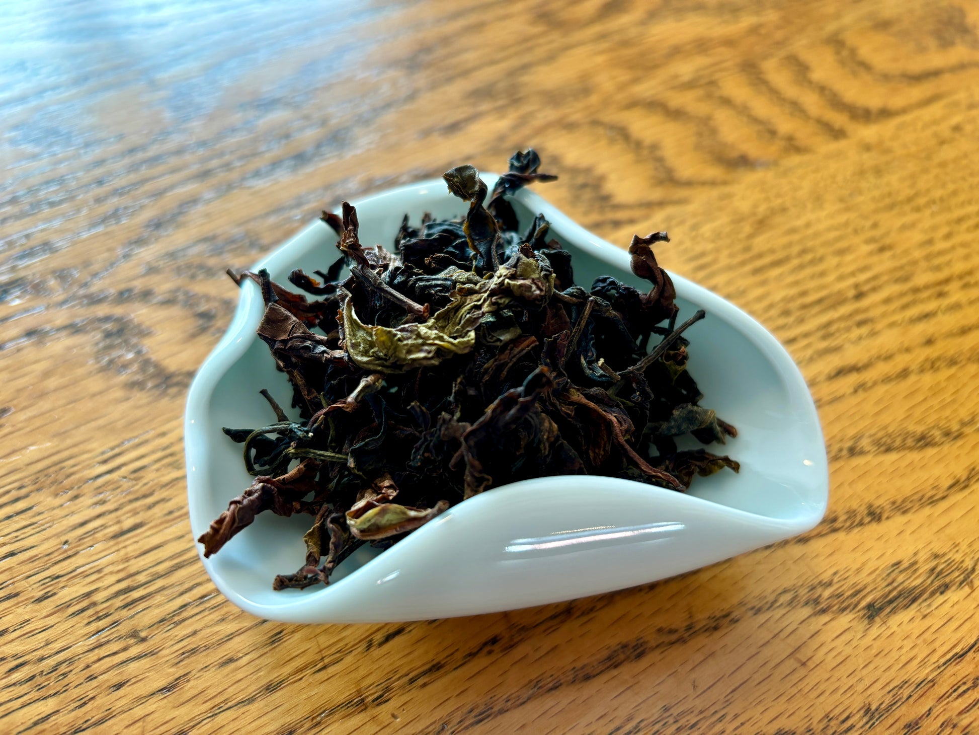 A ceramic display of dried loose black tea