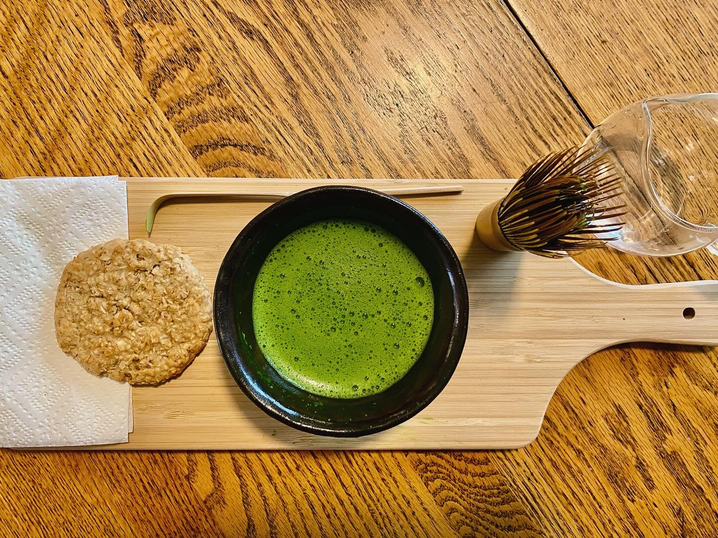 Oat cake beside a bowl of koicha matcha from Uji.